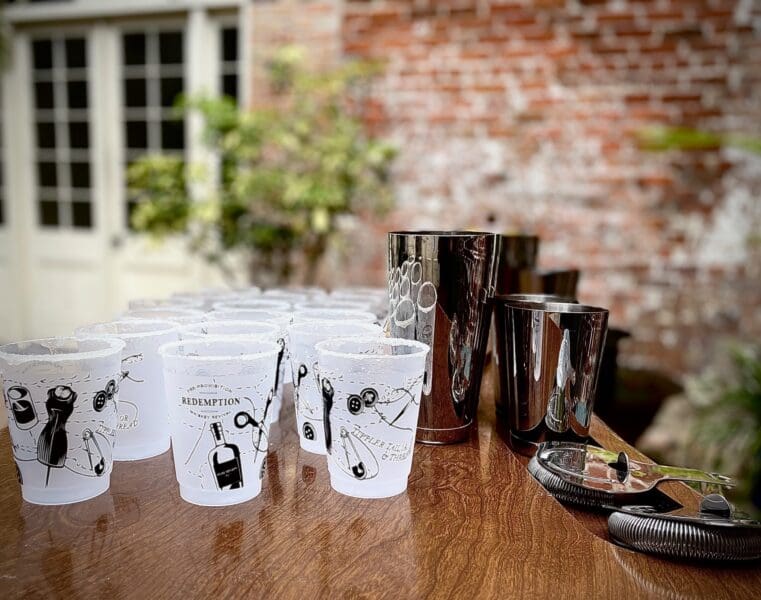 a few drink cups on a table at an event