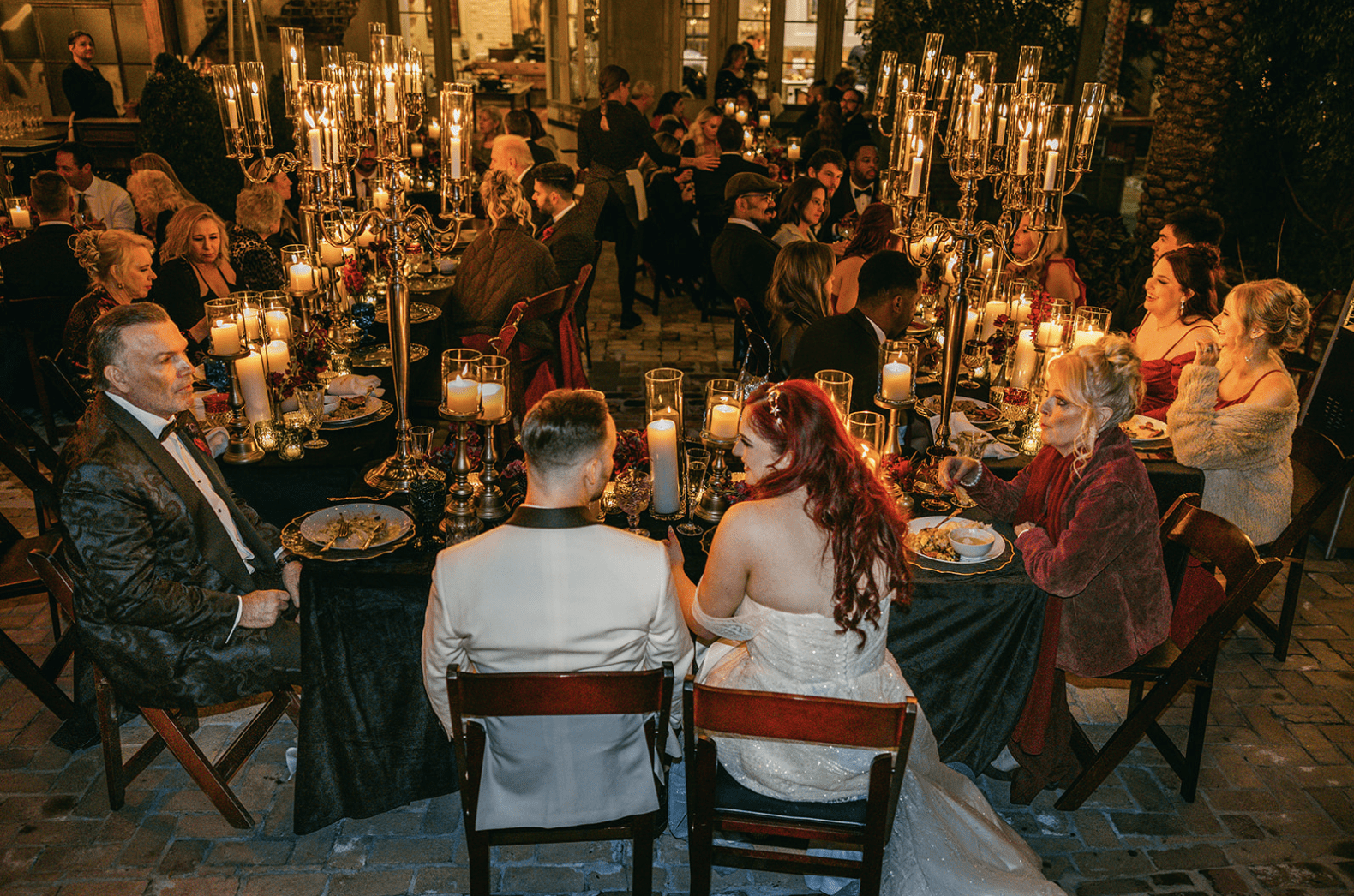 Lauren and Will at their wedding banquet table
