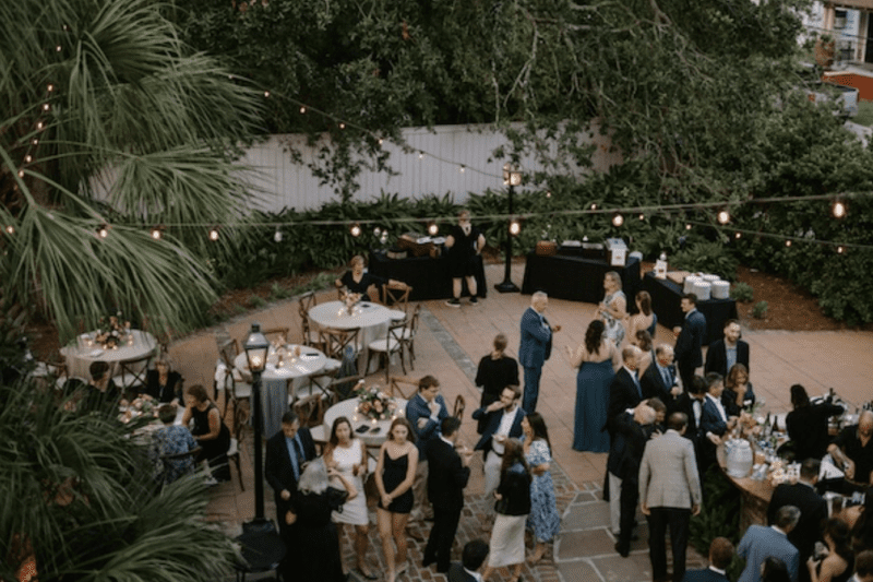aerial shot of a wedding crowd shows family style wedding food