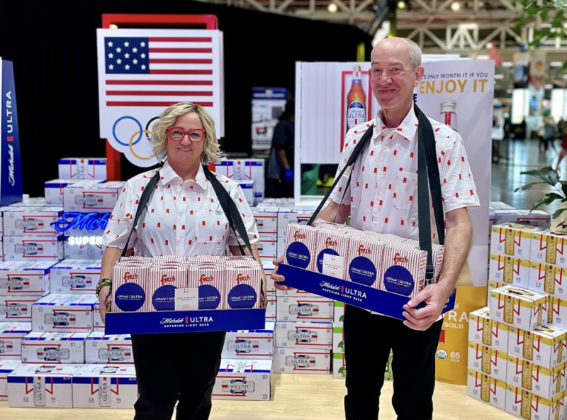 two people holding convention catering treats for private event goers